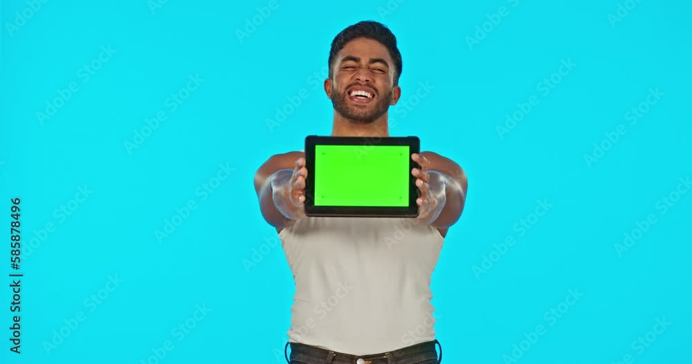 Face, green screen and man with tablet laughing in studio isolated on a blue background. Funny technology, mockup and happy male model with product placement, marketing or advertising for branding. Face, green screen and man with tablet laughing in studio isolated on a blue background. Funny technology, mockup and happy male model with product placement, marketing or advertising for branding.