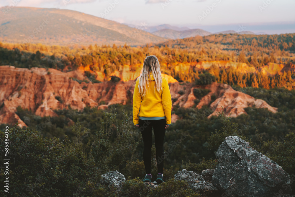 Naklejka premium Woman traveling outdoor exploring Gjipe canyon in Albania active healthy lifestyle in mountains summer vacations eco tourism