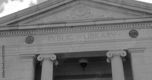 Inscriptions On Main Facade And Entrance Of Howard Whittemore Memorial Library In Naugatuck, Connecticut, USA. low angle, pan right photo