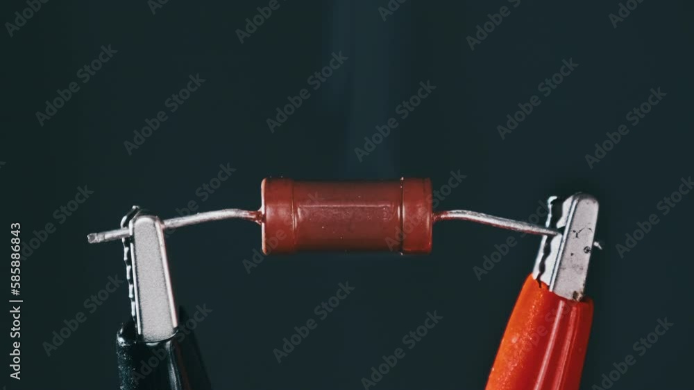 The resistor heats up with smoke under a high electric current, short