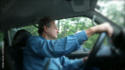 One elder mature man waiting in traffic driving car