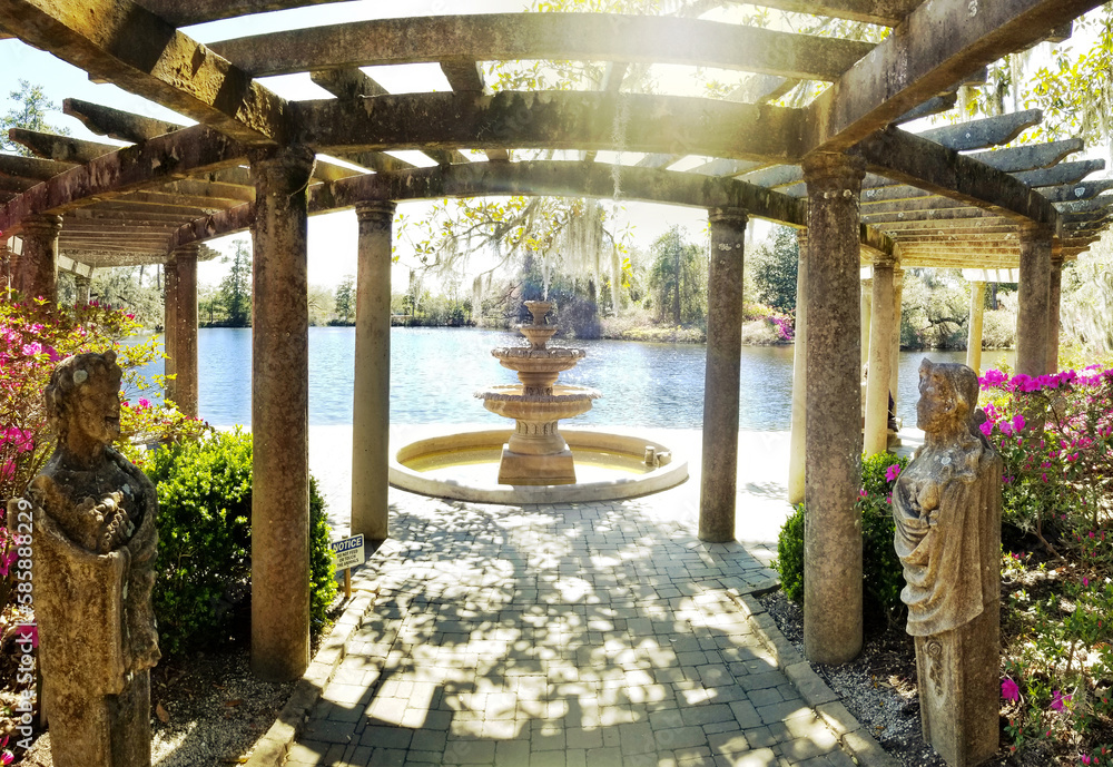 Beautiful fountain and trellis on the lake in Airlie Gardens , Wilmington , NC