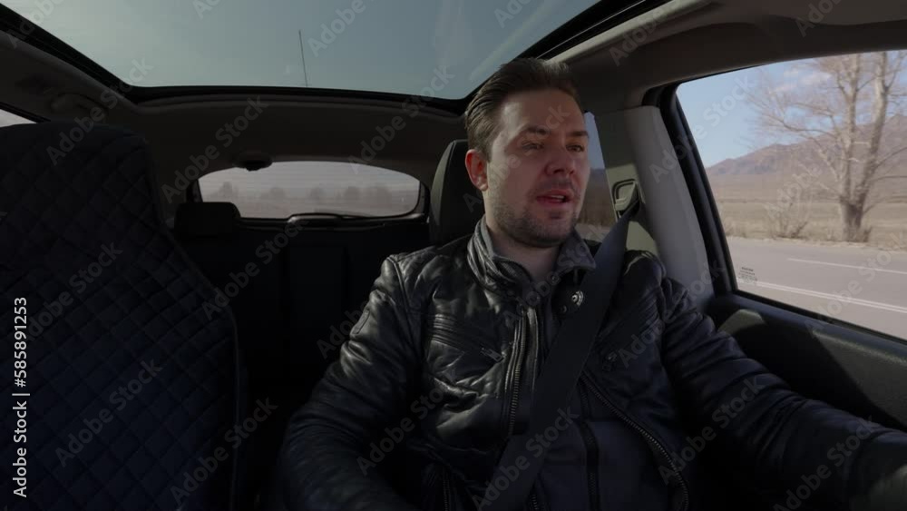 Man driving car at sunny day interior view Man driving car at sunny day interior view
