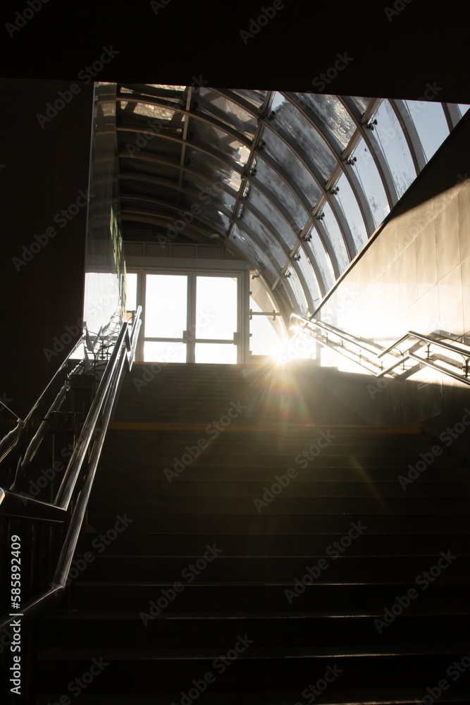 Obraz premium Sunlight on a dark staircase close up