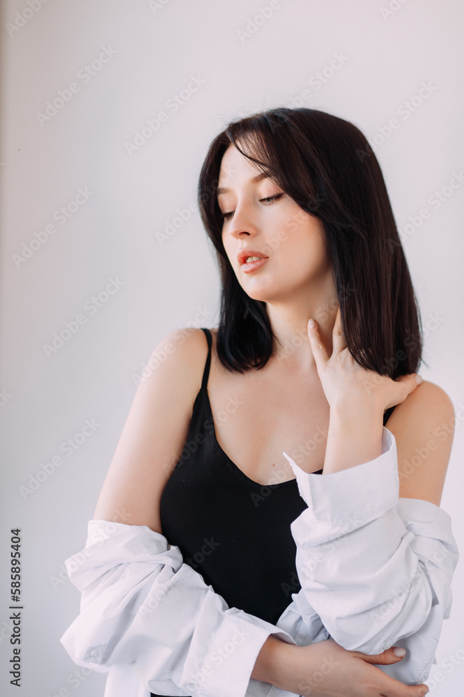 Portrait of a girl with black hair with a white sweater and a black dress 4522. Portrait of a girl with black hair with a white sweater and a black dress 4522.