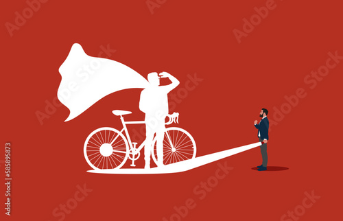 Business superhero cyclist concept with businessman and flashlight. Symbol of ambition, motivation and inspiration.