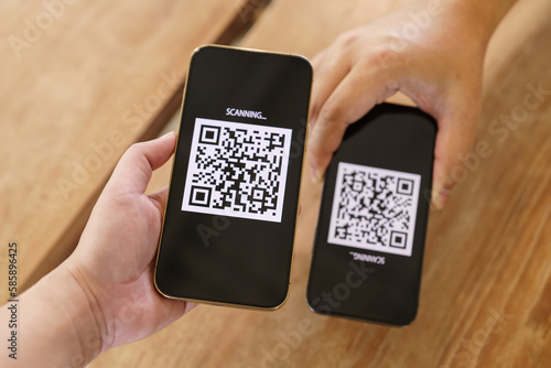 Qr code payment. E wallet. Man scanning tag accepted generate digital pay without money.scanning QR code online shopping cashless payment and verification technology concept.