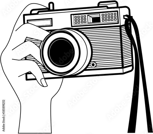 Hand holding vintage camera 