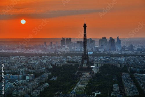 Golden Hour in the City of Light: A stunning panoramic view of Parisian streets and the iconic Eiffel Tower at sunset, capturing the romantic ambiance of the French capital