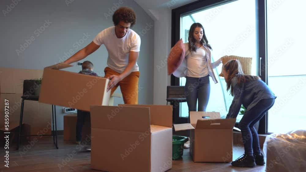Mixed race family moving into their new home. They're unpacking and having fun together.
Mixed race family moving into their new home. They're unpacking and having fun together.