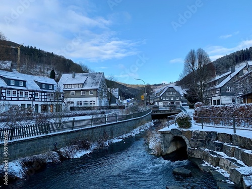 Snow covered town and wood near the german town of Winterberg in province Sauerland, Germany