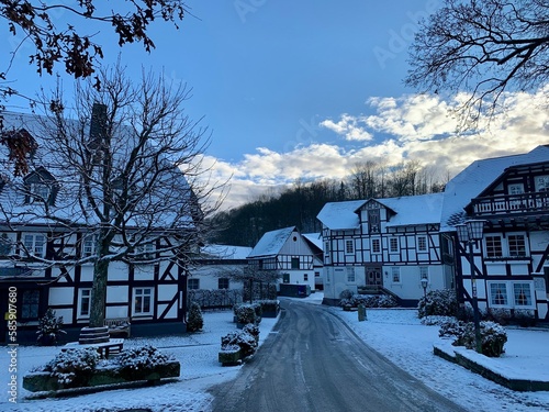 Snow covered town and wood near the german town of Winterberg in province Sauerland, Germany
