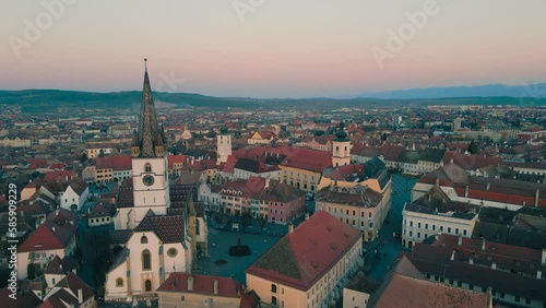 Wallpaper Mural Drone footage of the medieval city center of Sibiu, Romania at sunset. The video was shoot from a drone at sunset while flying forward towards the Cathedral with the camera level for a panoramic view. Torontodigital.ca
