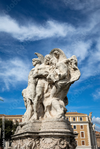 Statue on bridge Sant Peter square during sunny day in Vatican city, Italy