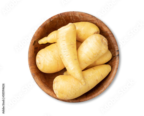 Raw mandioquinha or arracacha in a bowl isolated over white background photo