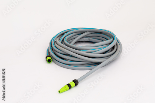 plastic gray hose for irrigation on a white background