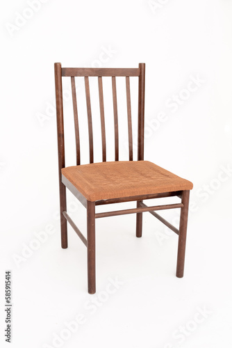 The vintage wooden brown chair with upholstered seat