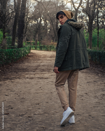 guy walking in the forest 