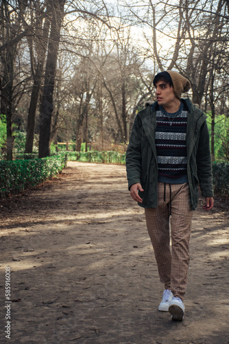 guy walking in the forest 