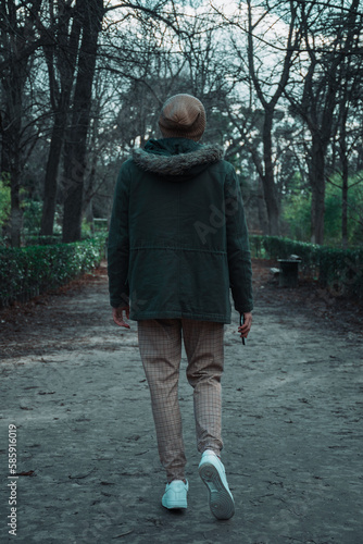 guy walking in the forest 