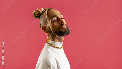 Black latin gay man isolated on pink background