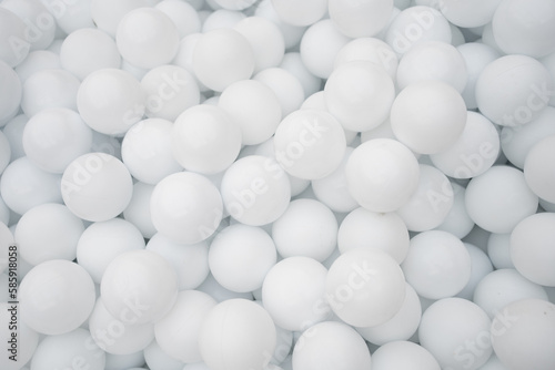 Many white plastic balls for dry pool.