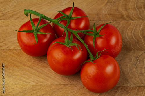 branch of ripe tomatoes, ripe red tomatoes