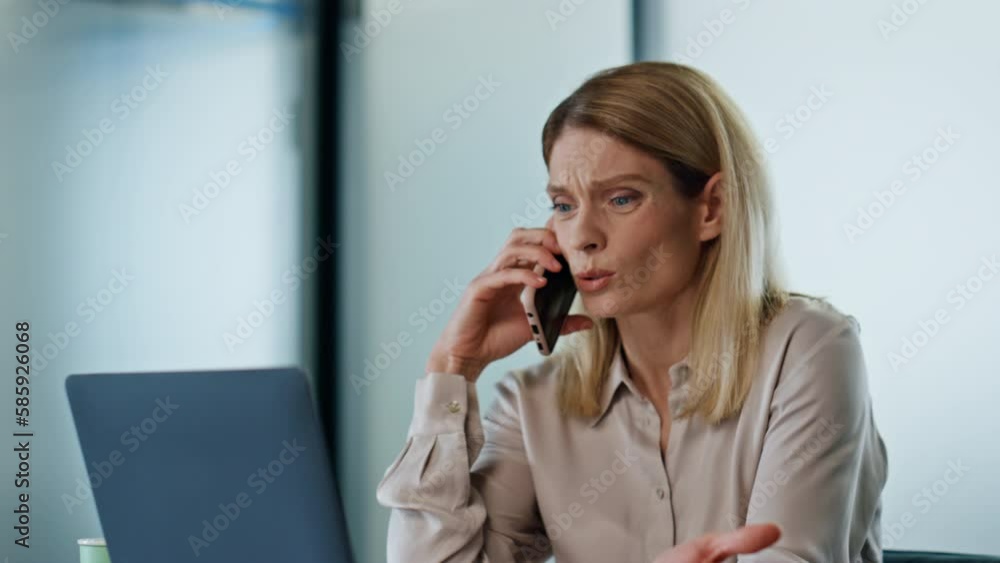 Upset boss talking cellphone at office close up. Sad woman loser fix problem Upset boss talking cellphone at office close up. Sad woman loser fix problem