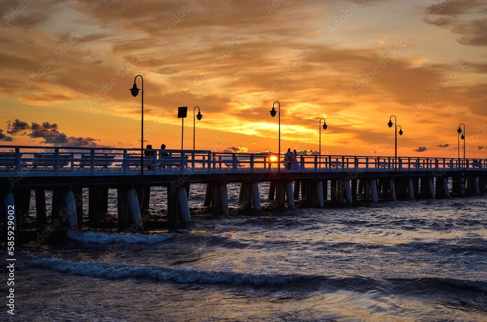 Obraz premium Beautiful morning seaside landscape. Popular pier in Gdynia, Poland at sunrise.