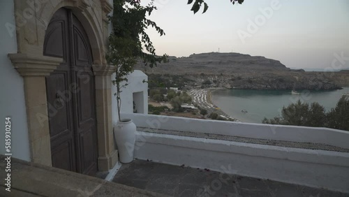 Chapel of Saint George Pahimahiotis and Lindos Beach below in Lindos, Lindos, Rhodes, Dodecanese Islands, Greek Islands, Greece, Europe photo