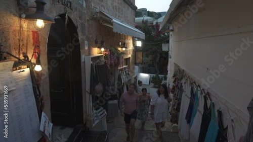 Shops in narrow street at dusk in Lindos, Lindos, Rhodes, Dodecanese Islands, Greek Islands, Greece, Europe
