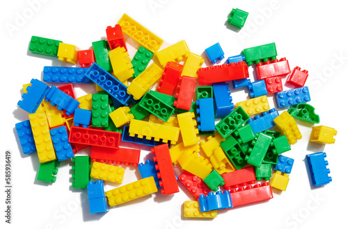 Multi-colored plastic cubes of a children's designer on a white isolated background, top view