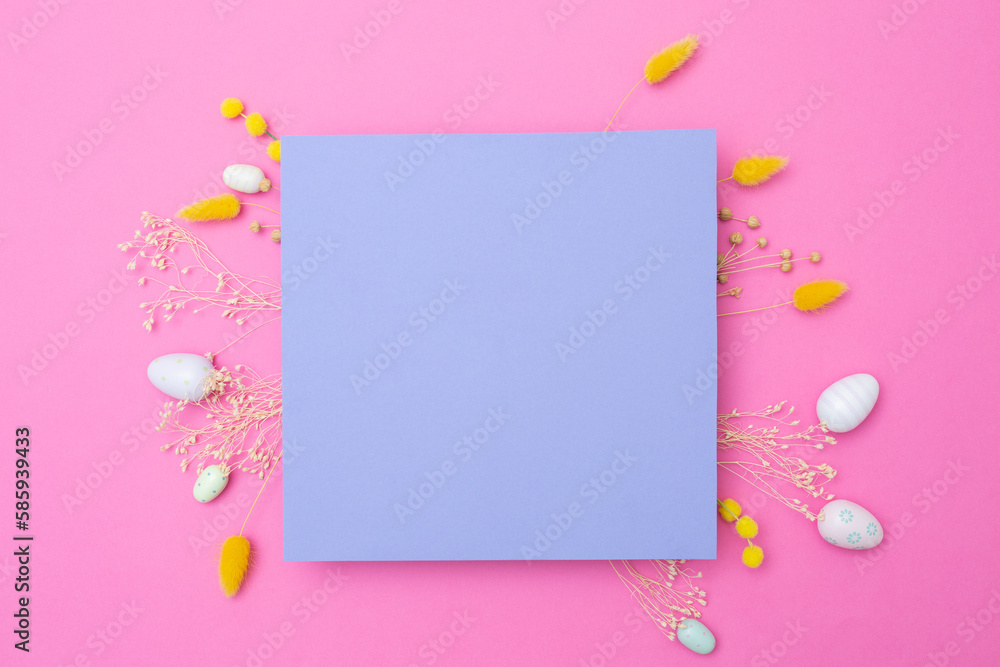 Happy Easter. Empty viola paper with arrangement of Easter eggs and spring dried flowers on pink background. Mockup of cards. Happy Easter. Empty viola paper with arrangement of Easter eggs and spring dried flowers on pink background. Mockup of cards.