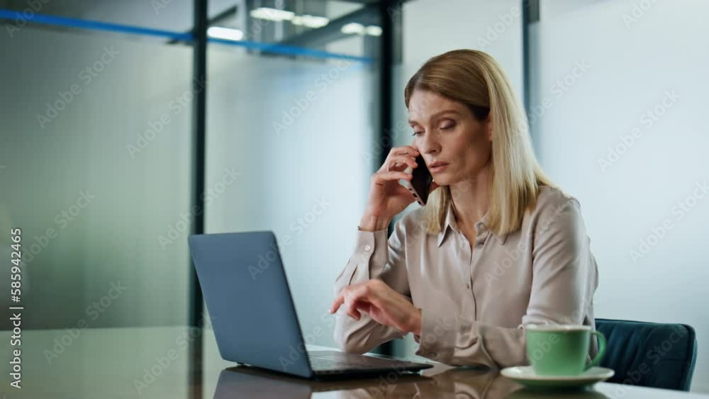 Confident manager speaking cellphone office interior. Closeup ceo calling mobile Confident manager speaking cellphone office interior. Closeup ceo calling mobile