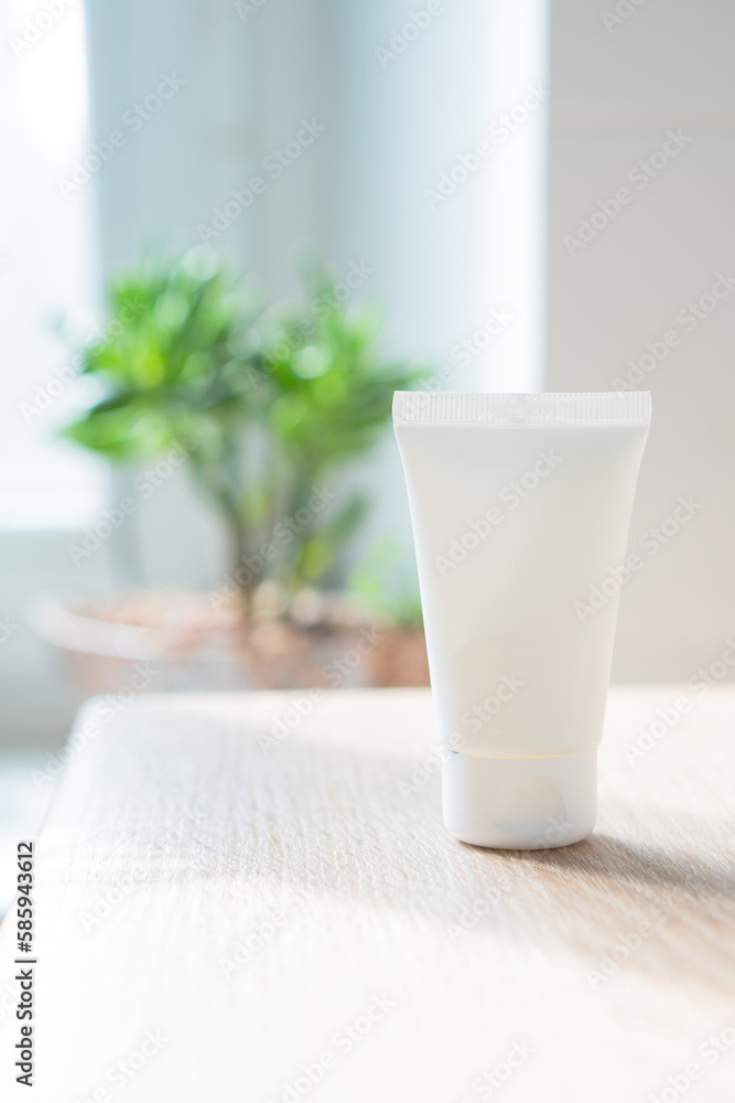 White cream tube in real room interior mock-up, beauty and care product packaging template White cream tube in real room interior mock-up, beauty and care product packaging template