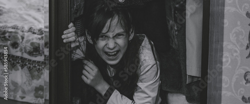 Εκτύπωση καμβά Mad scary girl in cupboard at dark night