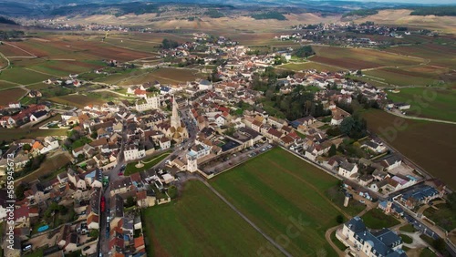 Aerial around the village Meursault in France on a cloudy afternoon in late winter. photo