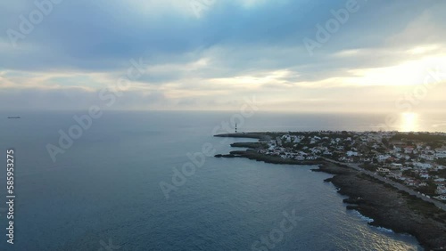 Wallpaper Mural Waves rolling along the coastline as drone flys past with sun dropping below the horizon at sunset. Torontodigital.ca