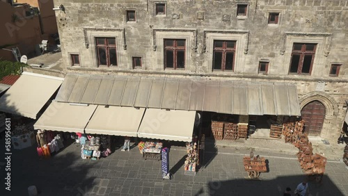 Shops and cafes in Evreon Martyron (Jewish Martyrs Square), City of Rhodes, Rhodes, Dodecanese Islands, Greek Islands, Greece, Europe photo