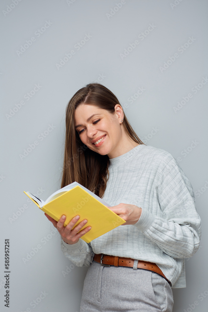 Young woman reading book. Isolated portrait. Young woman reading book. Isolated portrait.