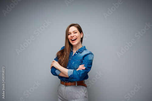 Smiling woman dressed casual. Isolated female portrait with arms.