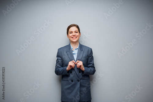 Smiling business woman in suit portrait with copy space.