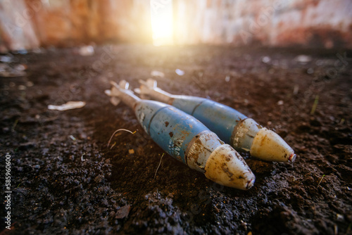 Valokuva Unexploded mortar mines on ground. War actions aftermath