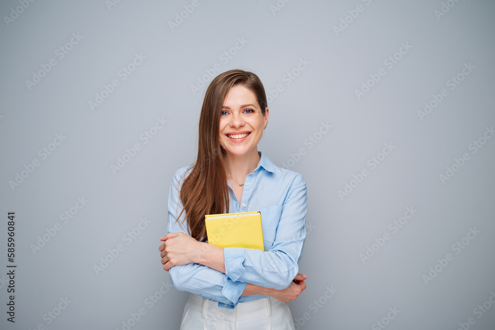 Smiling happy teacher woman or student girl with yellow book. Smiling happy teacher woman or student girl with yellow book.
