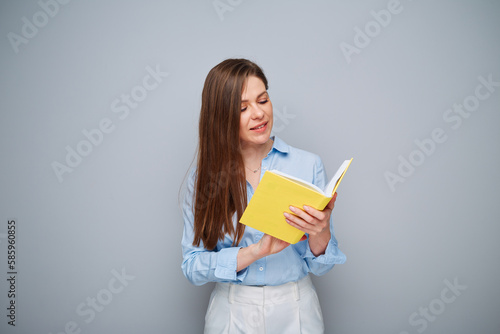 Smiling teacher or student woman holding open book. Isolated female portrait.