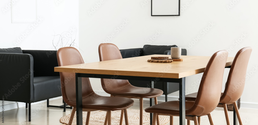 Interior of modern dining room with wooden table and brown chairs
