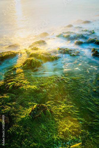  Coastal rocks with waves at sunset