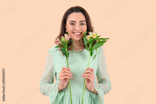 Smiling young woman holding...