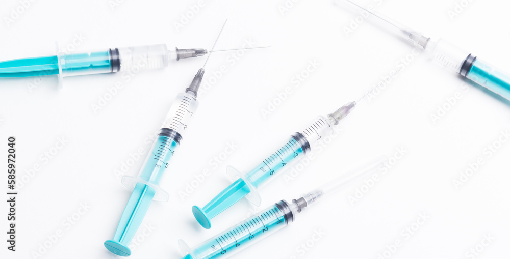 Disposable plastic syringe prepared for injection and vaccination in the hospital. The concept of medicine and health Disposable plastic syringe prepared for injection and vaccination in the hospital. The concept of medicine and health