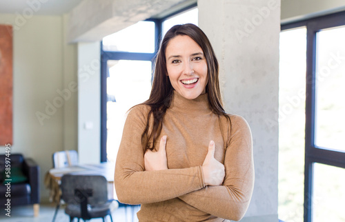 young adult pretty woman laughing happily with arms crossed, with a relaxed, positive and satisfied pose Free Download young adult pretty woman laughing happily with arms crossed, with a relaxed, positive and satisfied pose - GFXLoad